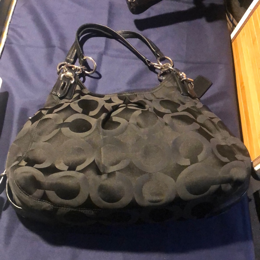 Black Coach bag with purple satin lining and silver hardware